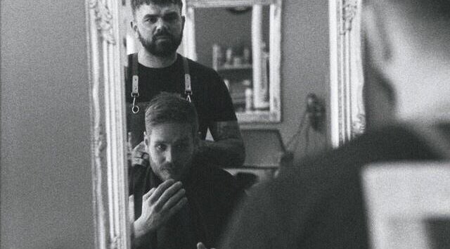 Travis Manning Hair Consultant working on a client in Great Yarmouth, England, GB.