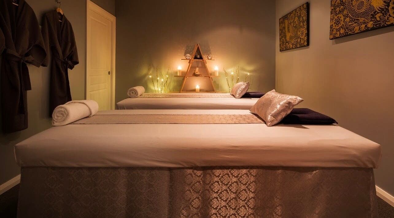 Cozy massage room at Arokaya Lanna Thai Massage and Day Spa, Greenway, ACT, AU, featuring warm lighting and decor.