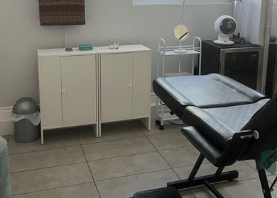 Cozy treatment room at LadyFace, Rancho Cucamonga, California, US, featuring a comfortable black chair.
