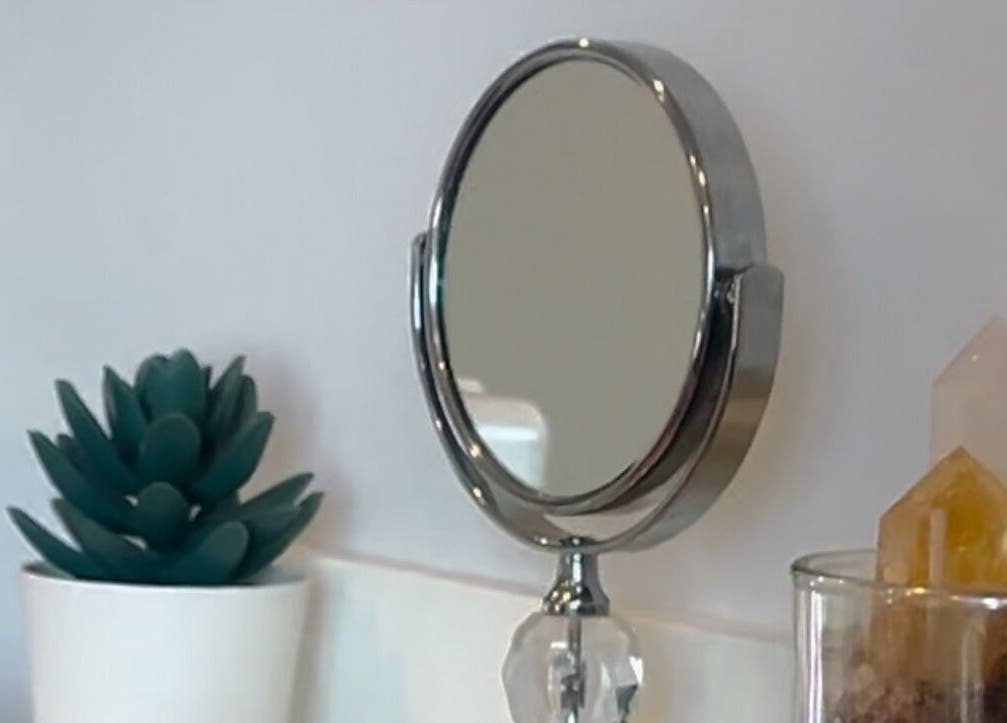 Round mirror with crystals and plant decor at LadyFace, Rancho Cucamonga, California, US.
