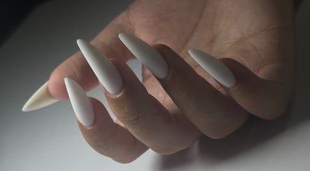 Chic stiletto nails in white at Bespoke Nail & Lash By Tran, Fairfield Heights, New South Wales, AU.