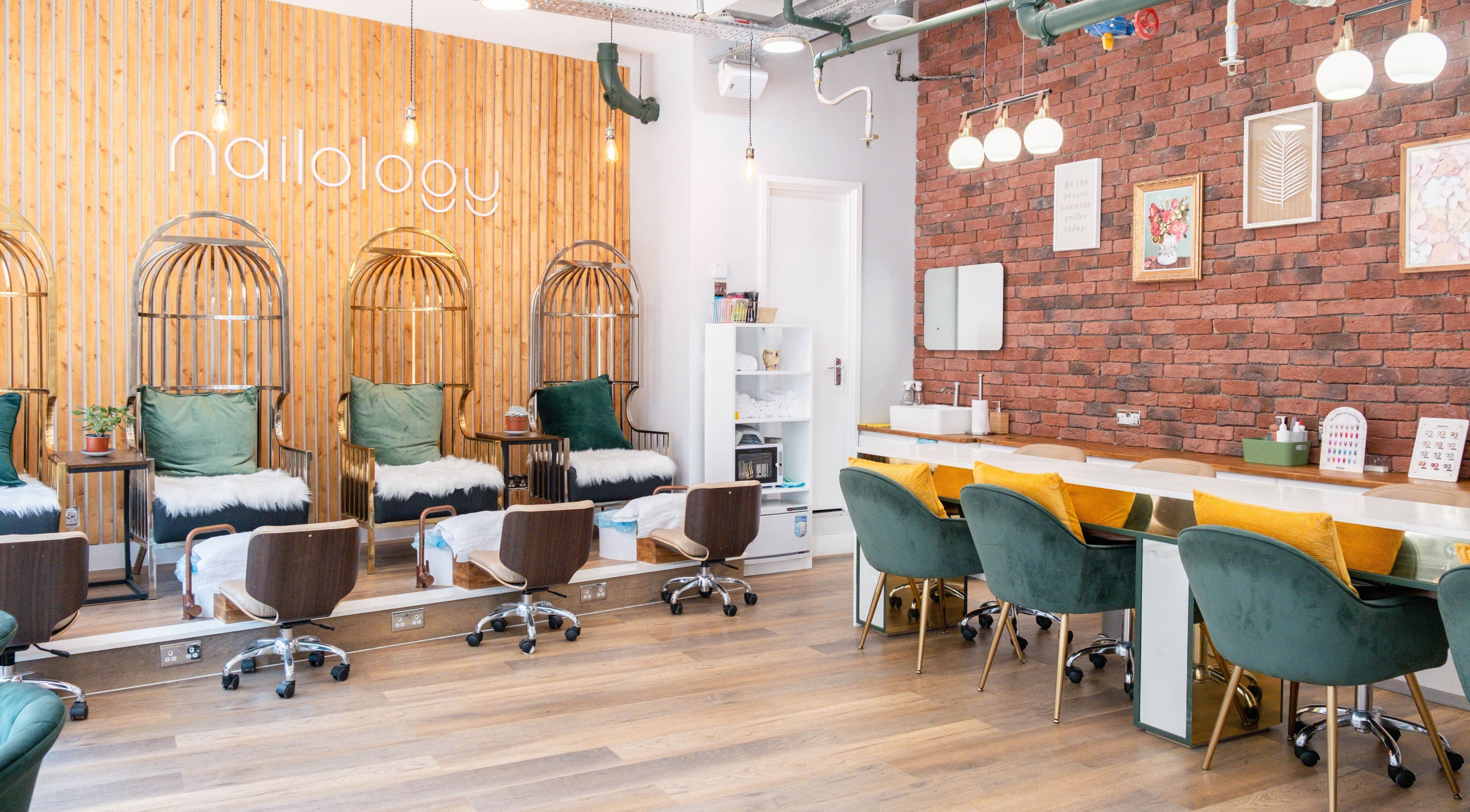 Stylish interior of Nailology Old Street in London, England, GB featuring elegant seating and warm decor.