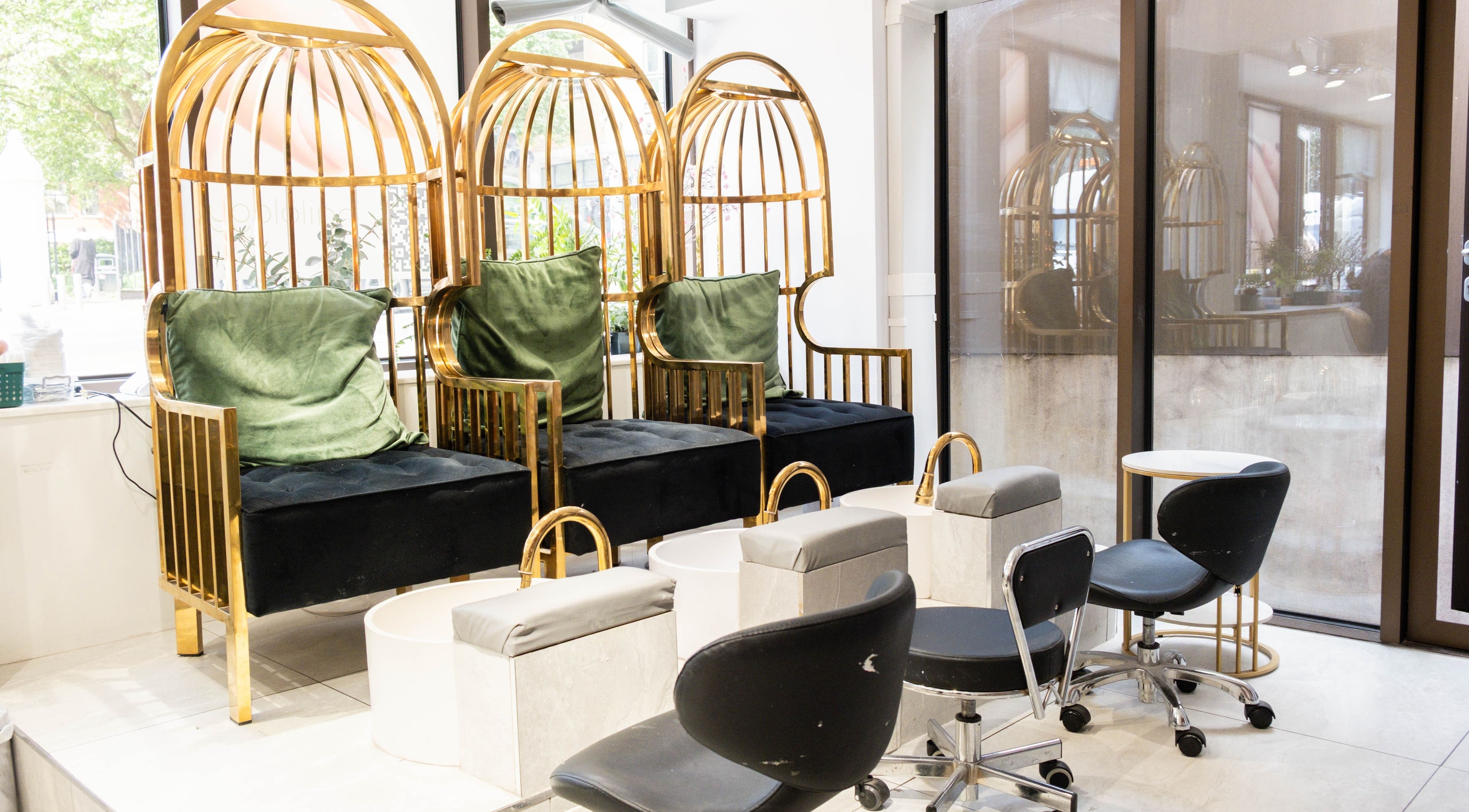 Luxurious pedicure chairs at Nailology Goswell Road in London, England, GB highlighting comfort and elegance.