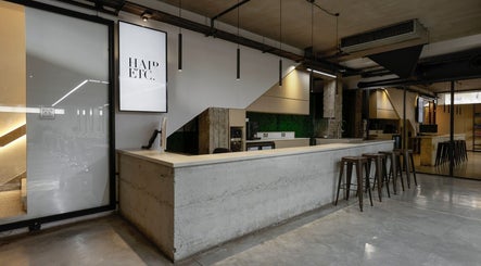 Chic interior of HAIR ETC. Studio in Nicosia, CY featuring a minimalist reception area.