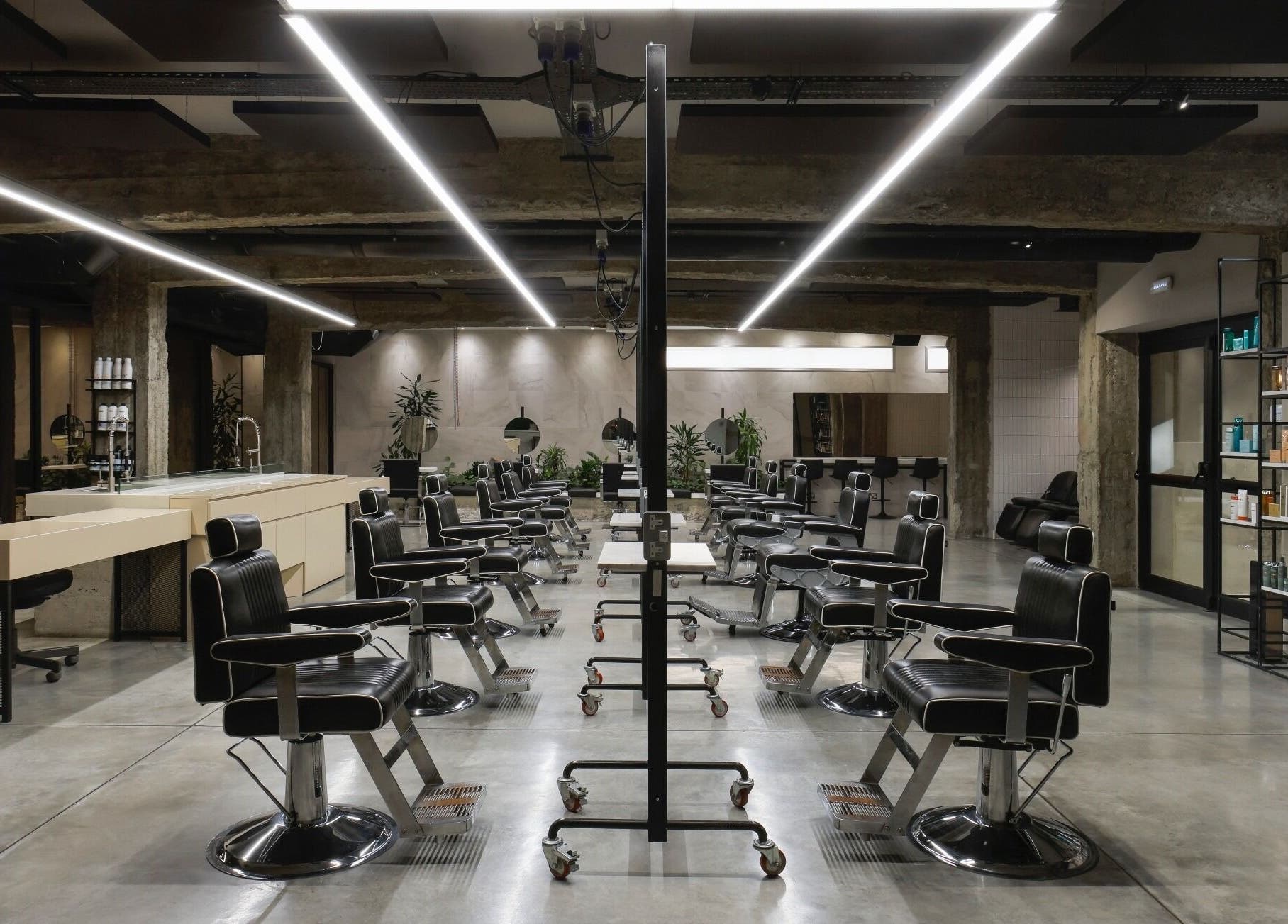 Modern salon interior at HAIR ETC. Studio, Nicosia, CY, showcasing sleek chairs and stylish decor.