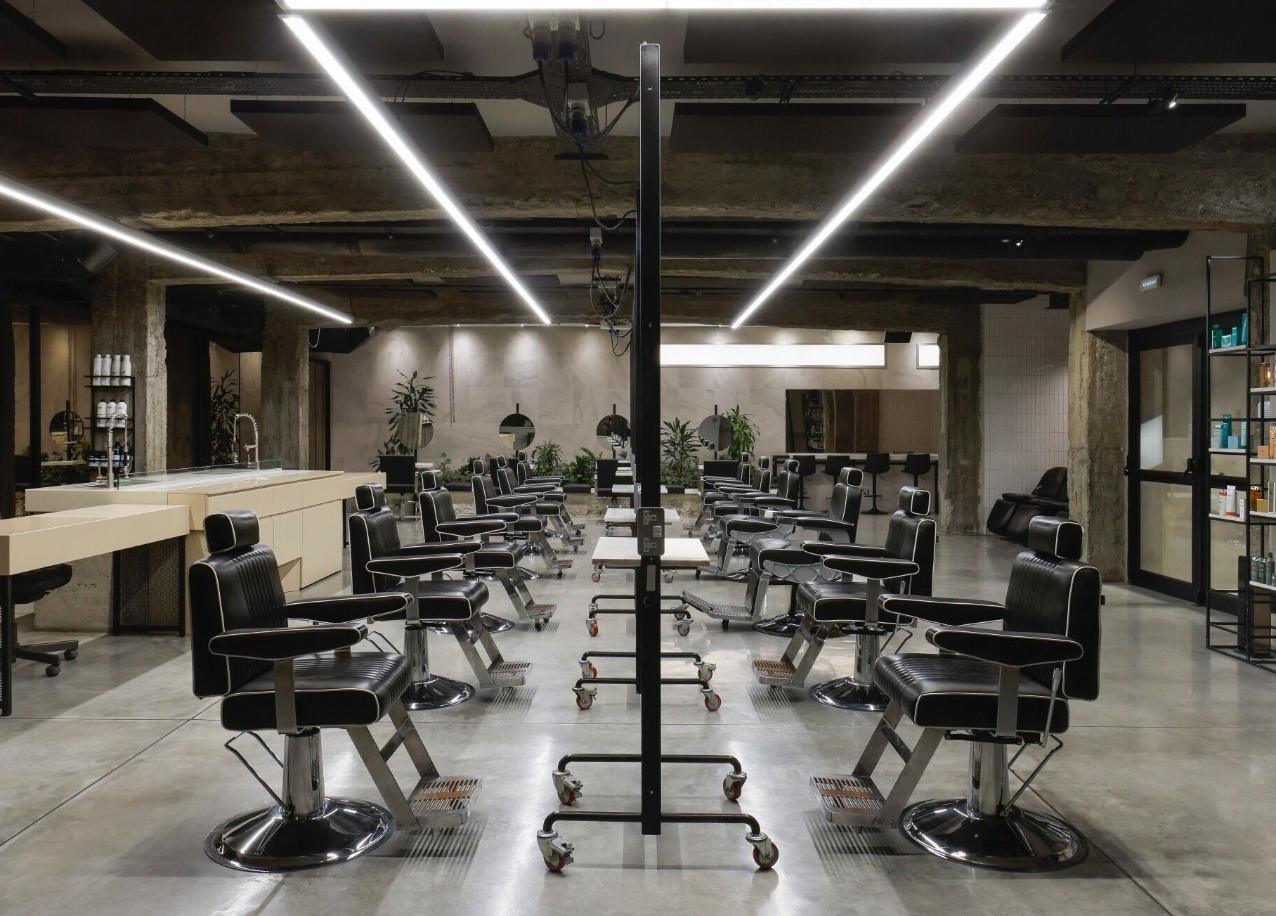 Modern salon interior at HAIR ETC. Studio, Nicosia, CY, showcasing sleek chairs and stylish decor.