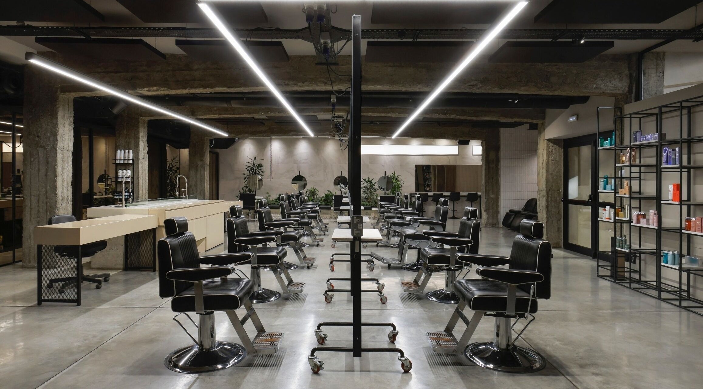 Modern salon interior at HAIR ETC. Studio, Nicosia, CY, showcasing sleek chairs and stylish decor.
