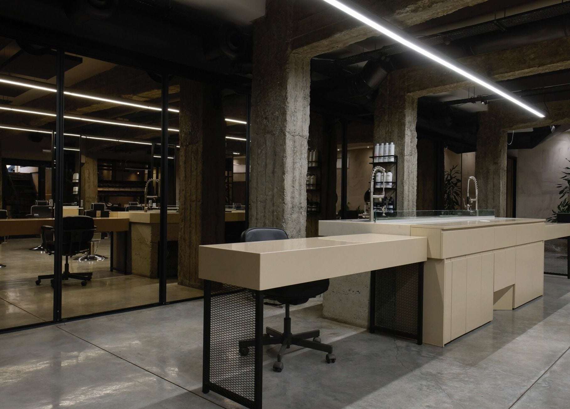 Modern interior of HAIR ETC. Studio, Nicosia, CY, with sleek chairs and minimalist design.