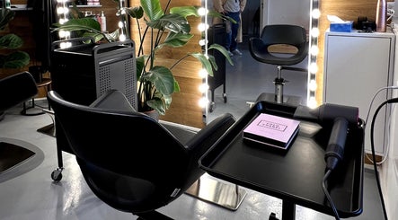Elegant salon setup at David Nukri, Frederiksberg, Denmark, DK featuring modern chairs and soft lighting.