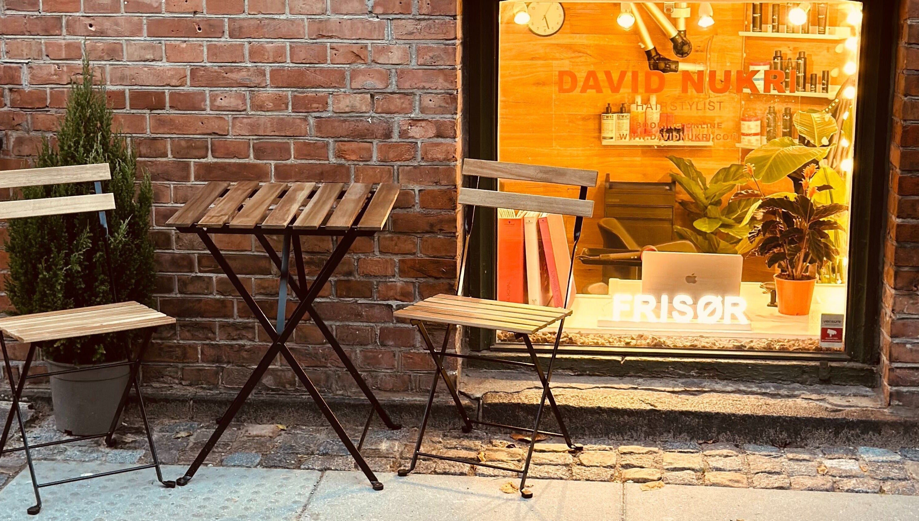 David Nukri salon facade with cozy seating in Frederiksberg, Denmark, DK.
