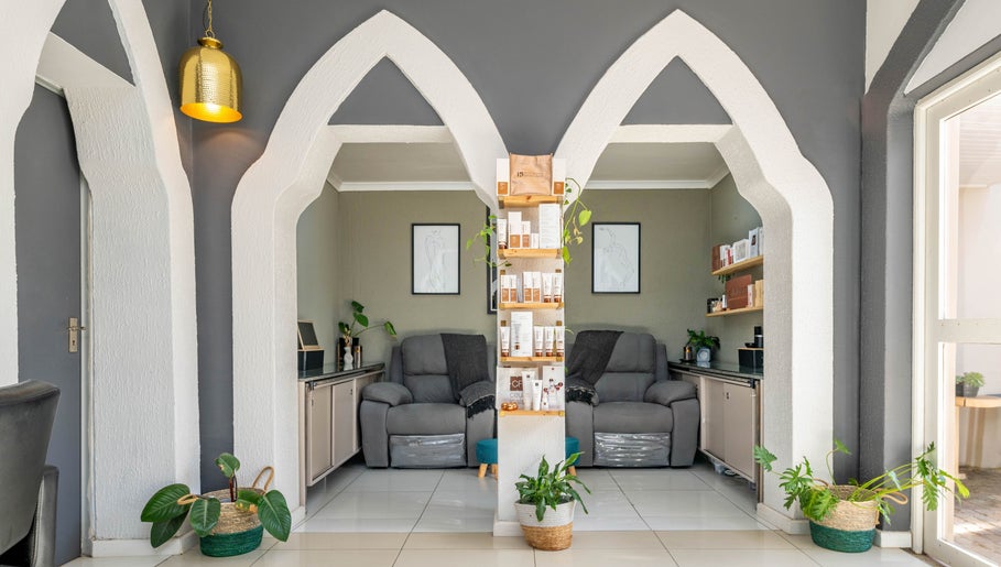 Relaxing seating area at Golden Olive | Nail & Lash Bar in Cape Town, Western Cape, ZA with elegant arch designs.
