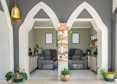 Relaxing seating area at Golden Olive | Nail & Lash Bar in Cape Town, Western Cape, ZA with elegant arch designs.