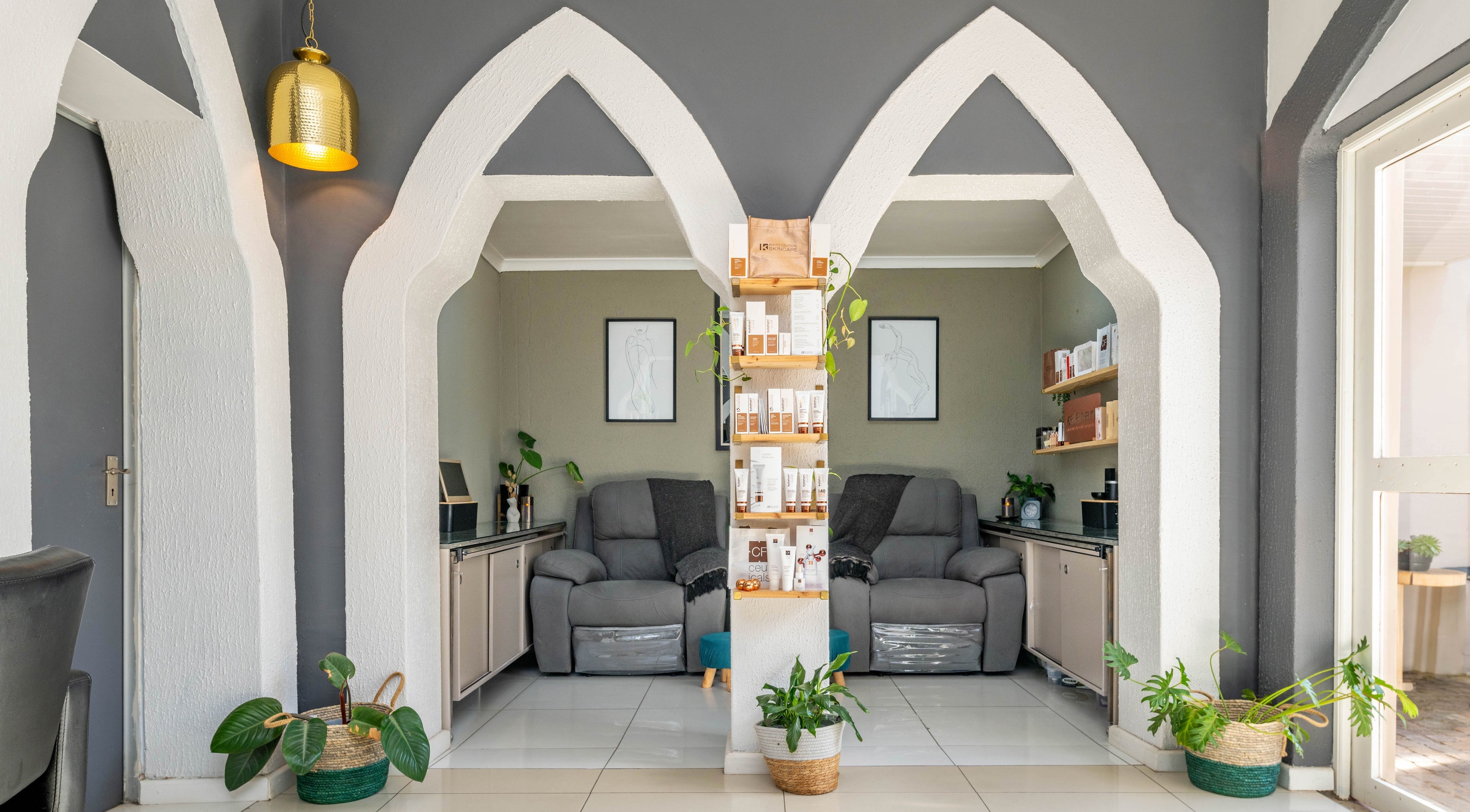 Relaxing seating area at Golden Olive | Nail & Lash Bar in Cape Town, Western Cape, ZA with elegant arch designs.