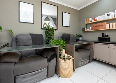 Relaxed seating area at Golden Olive | Nail & Lash Bar, Cape Town, Western Cape, ZA with stylish decor.