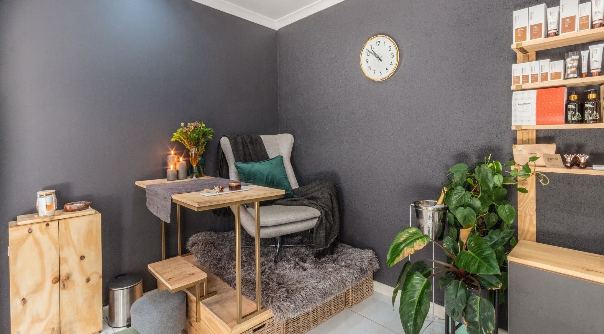 Relaxing treatment area at Golden Olive | Beauty Studio, Cape Town, Western Cape, ZA with plush seating and decor.