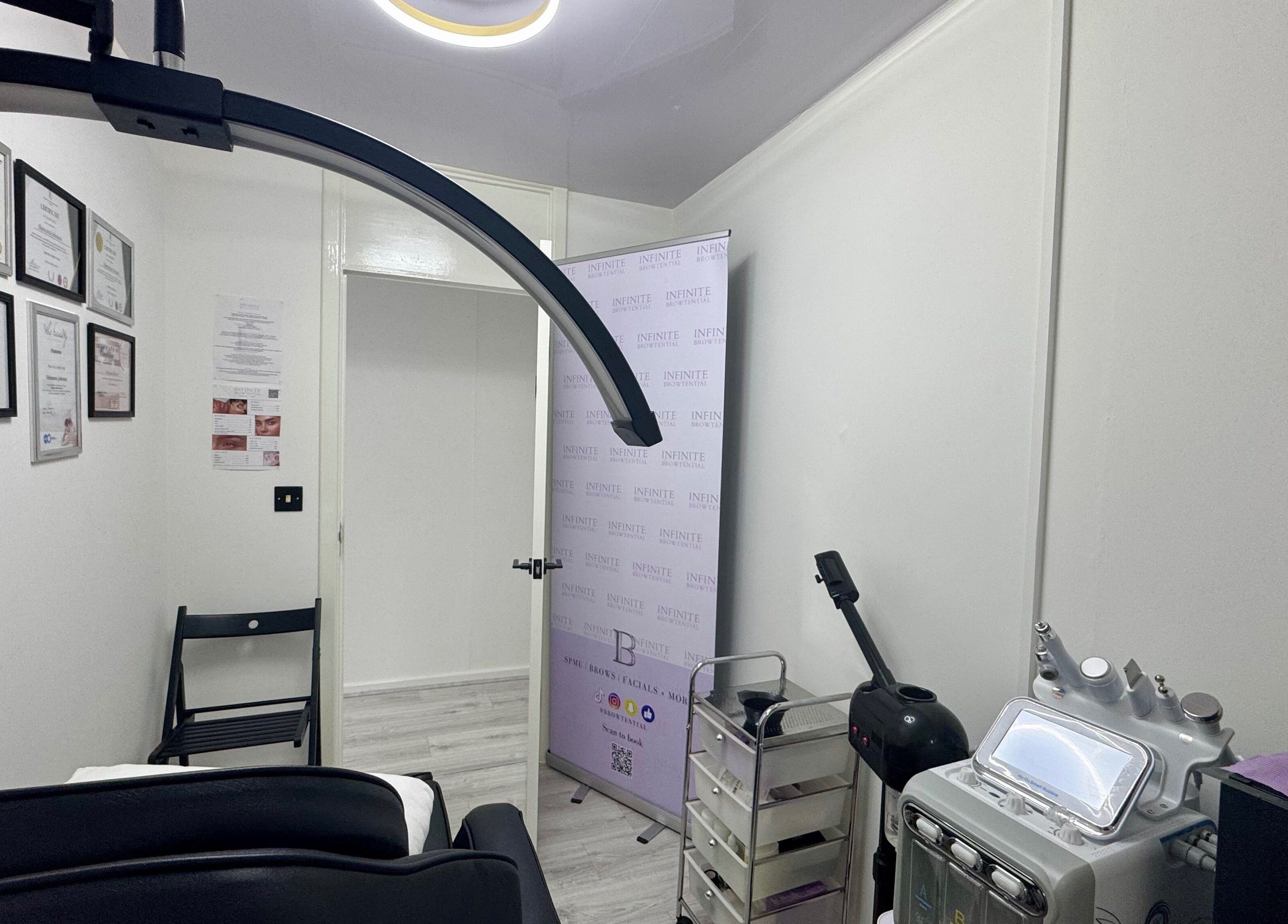 Infinite Browtential's modern treatment room in Birmingham, England, GB, featuring advanced beauty equipment.