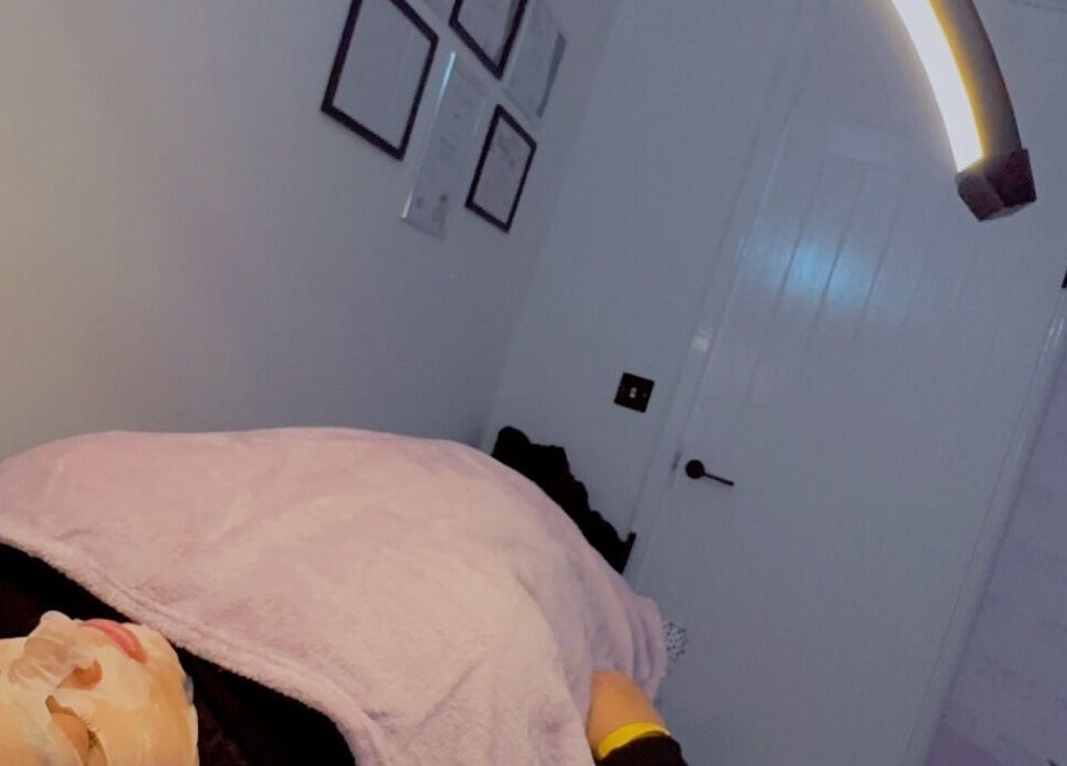 Relaxing facial treatment at Infinite Browtential, Birmingham, England, GB with ambient lighting.