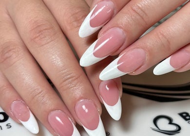 Close-up of elegantly manicured pink nails with white tips at Art In Makeup, Il-fgura, MT.