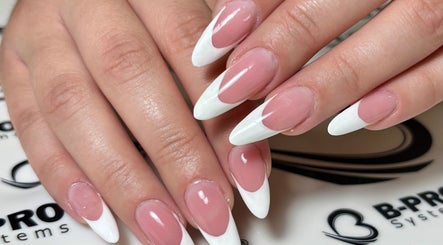Close-up of elegantly manicured pink nails with white tips at Art In Makeup, Il-fgura, MT.