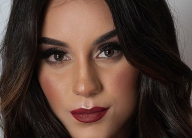 Close-up of elegant makeup look by Art In Makeup, Il-fgura, MT, showcasing bold lips and defined eyes.