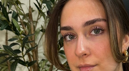 Close-up of styled lashes at Sculpt Studio - Studio des Cils, Laval, Québec, CA featuring lush greenery.