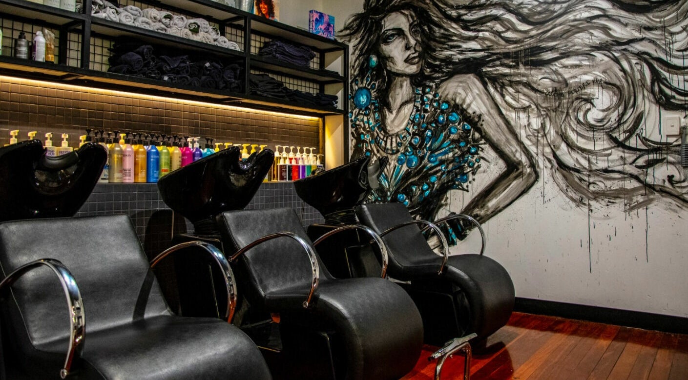 Stylish hair washing stations at Aaron Paul for Hair, Inglewood, Western Australia, AU with artistic mural.
