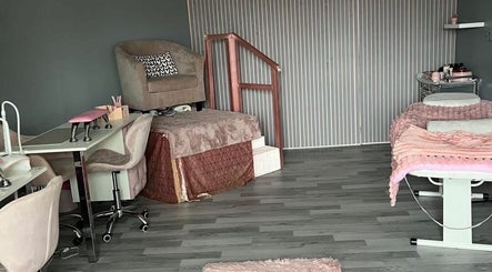Chic nail salon interior at Nails and Beauty By Lauren Cowan in Ayr, Scotland, GB with plush seating and elegant decor.
