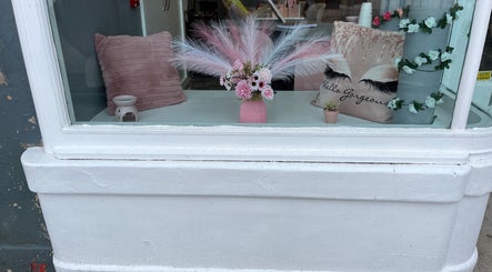 Elegant floral decor in window display at Nails and Beauty By Lauren Cowan, Ayr, Scotland, GB.