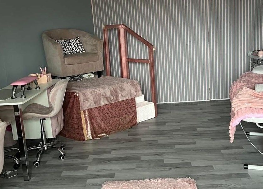 LJMs Beauty Bar's elegant setup with plush seating and a treatment bed in Ayr, Scotland, GB.