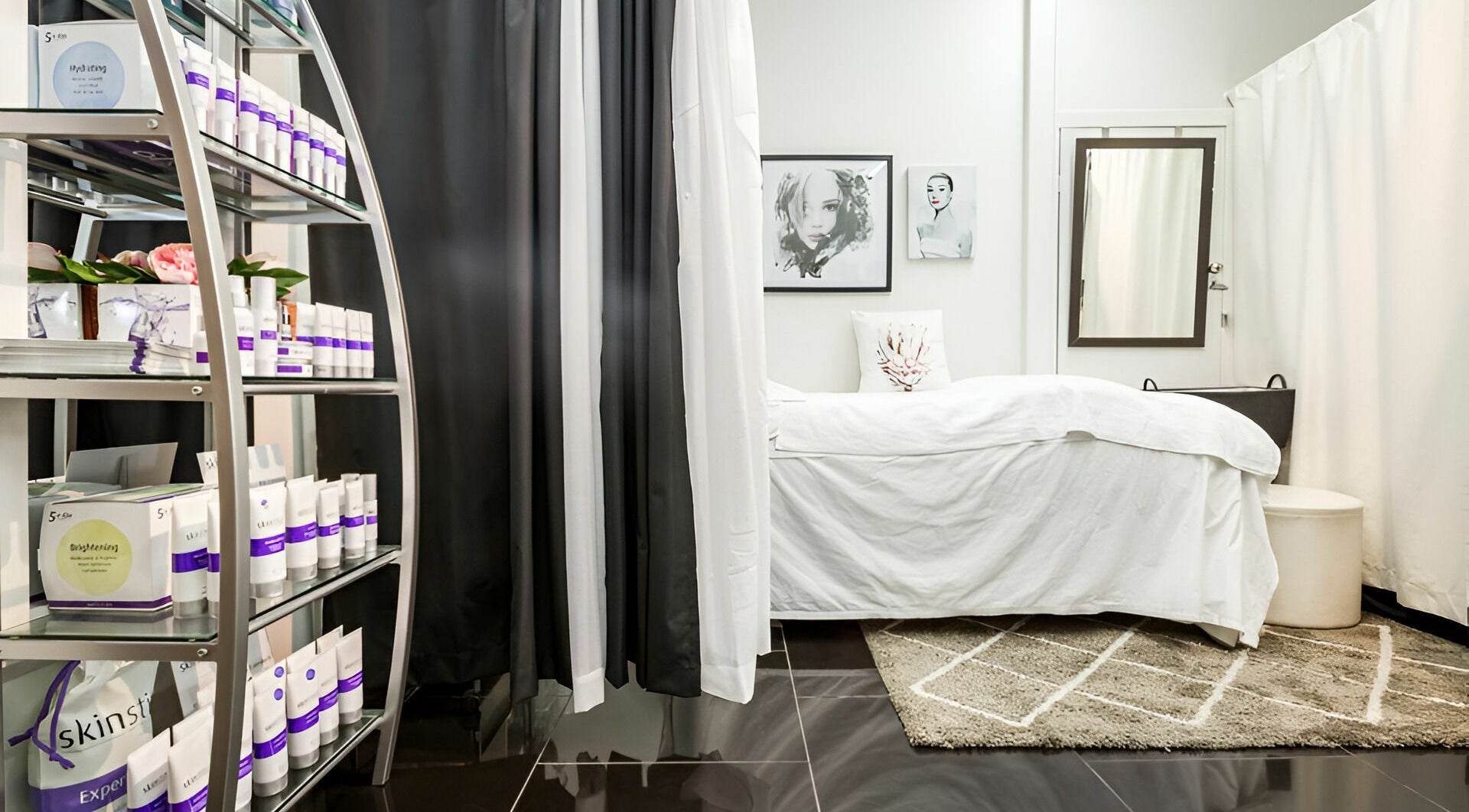 Serene treatment room at Precious Beautee, Ashfield, New South Wales, AU, featuring plush bedding and skincare products.