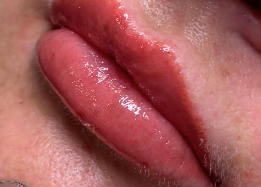 Close-up of glossy lips treatment at EveLashes, Brows & Beauty, Southampton, England, GB.