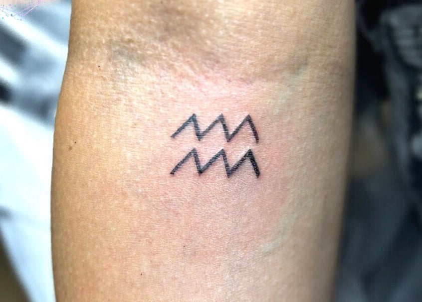 Minimalist tattoo design at EveLashes, Brows & Beauty, Southampton, England, GB. Unique body art expression.
