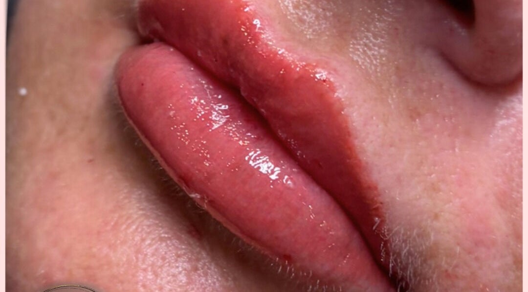 Close-up of glossy lips treated at EveLashes, Brows & Beauty, Southampton, England, GB.