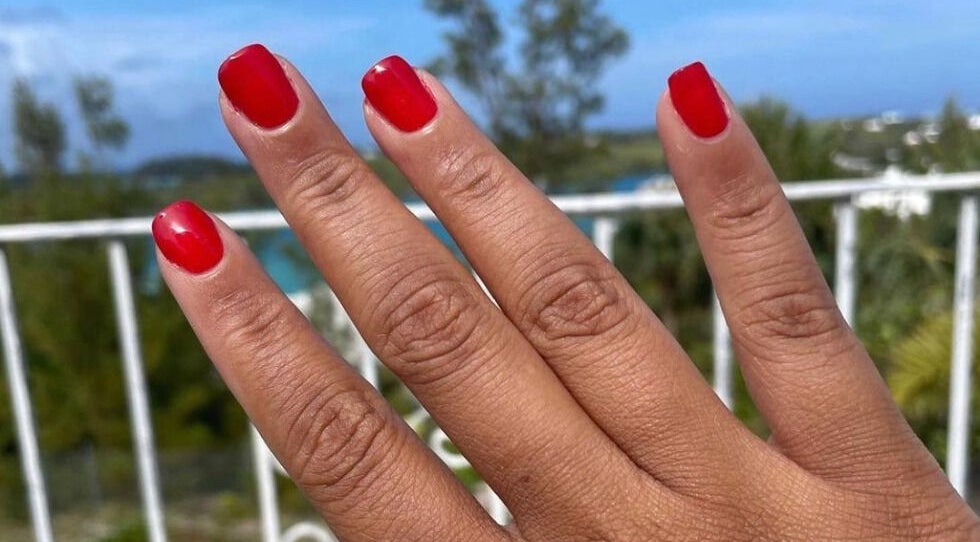 Vibrant red nails at Lacquered Lounge, Town Of St. George, St. George's Parish, BM, offering stunning views.