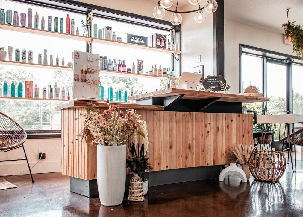 Stylish interior of Studio 45:11 Salon in Seymour, Tennessee. Modern reception and elegant decor.