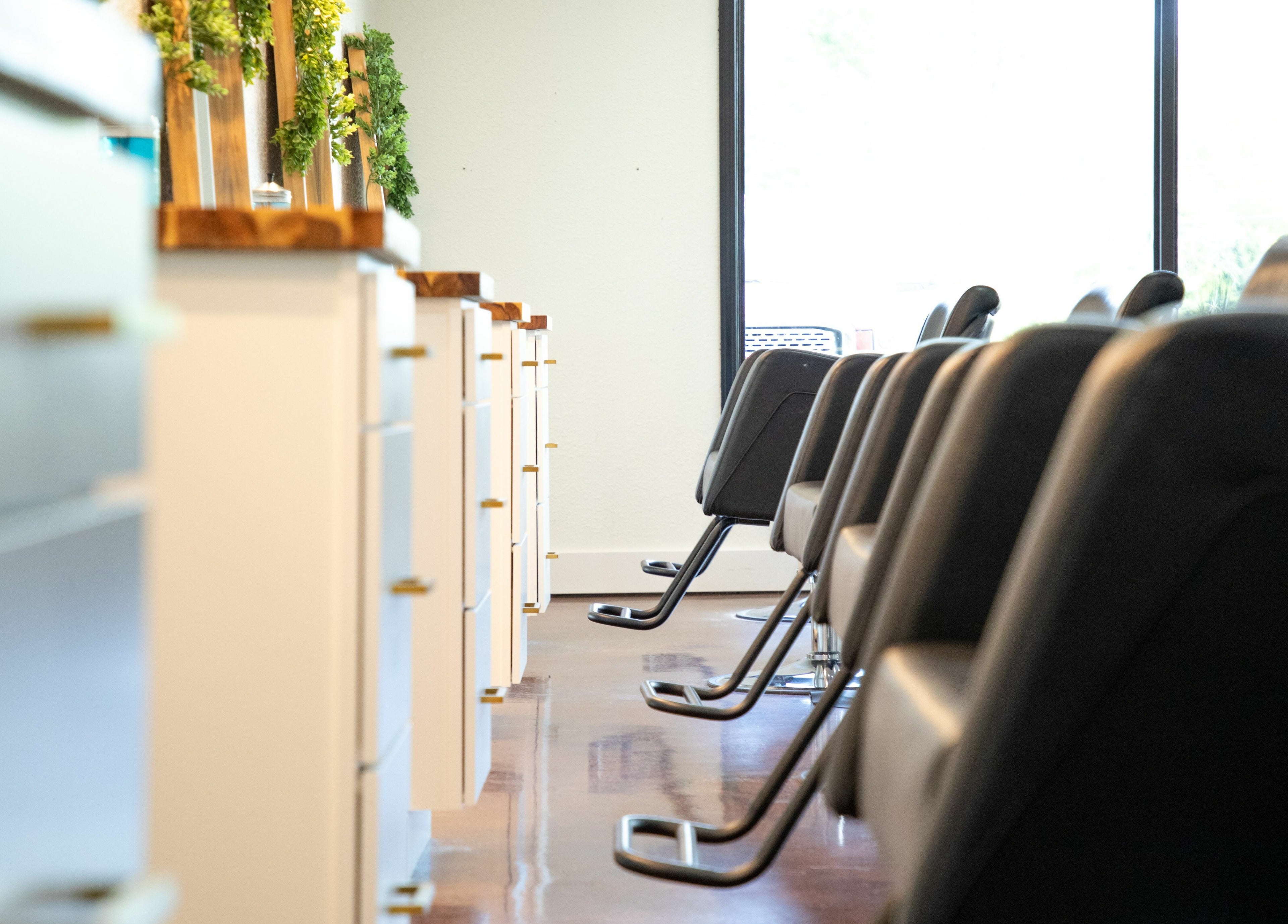 Stylish chairs line the salon area at Studio 45:11 Salon, Seymour, Tennessee, US, showcasing modern elegance.