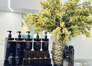 Luxury hair products and floral decor at Devoue Hair, Melbourne, Victoria, AU, providing premium beauty services.