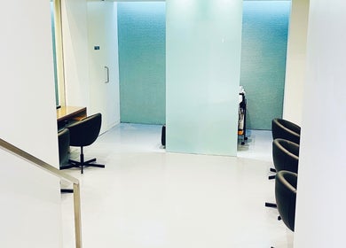 Sleek interior of Devoue Hair salon in Melbourne, Victoria, AU showcases modern design and comfort.