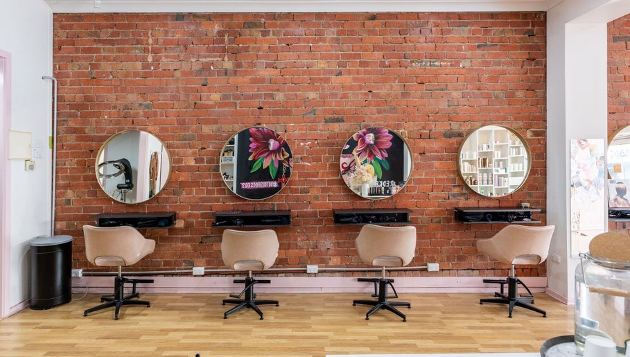 Elegant salon chairs and mirrors at M.O.H & Co, Melbourne, Victoria, AU enhance beauty treatments.