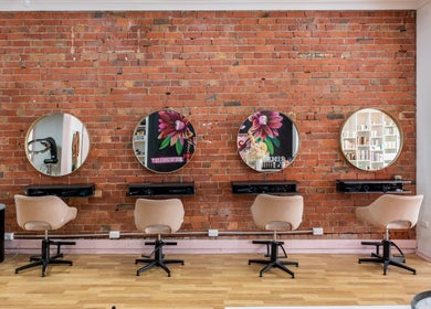 Elegant salon chairs and mirrors at M.O.H & Co, Melbourne, Victoria, AU enhance beauty treatments.