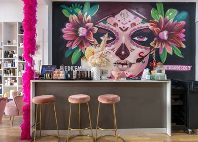 Stylish interior of M.O.H & Co in Melbourne, Victoria, AU with colorful mural and chic seating.