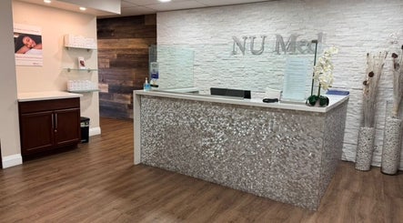 Sophisticated reception at NU Med Clinic and MediSpa, Toronto, Ontario, CA, with modern decor and calming ambiance.