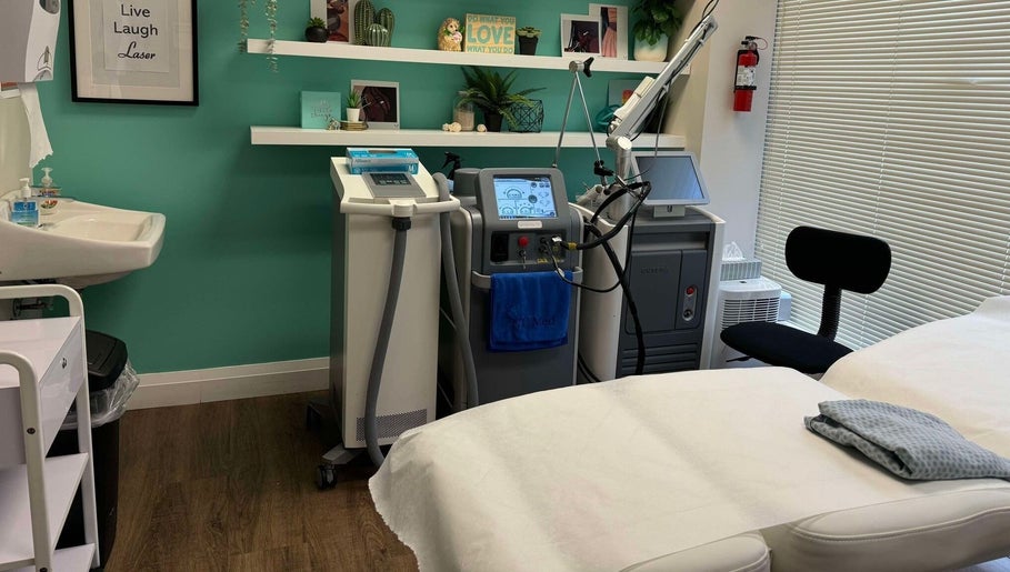Modern treatment room at NU Med Clinic and MediSpa in Toronto, Ontario, CA equipped with advanced laser machines.