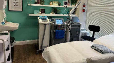 Modern treatment room at NU Med Clinic and MediSpa in Toronto, Ontario, CA equipped with advanced laser machines.