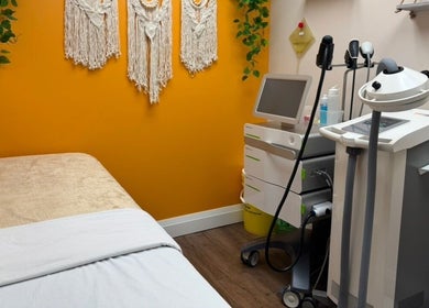 Calming treatment room at NU Med Clinic and MediSpa, Toronto, Ontario, CA, featuring cozy bed and equipment.