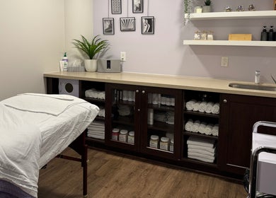 Tranquil spa treatment room at NU Med Clinic and MediSpa in Toronto, Ontario, CA, with towels and decor.