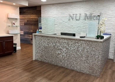 Reception area at NU Med Clinic and MediSpa, Toronto, Ontario, CA, featuring modern decor and welcoming ambiance.