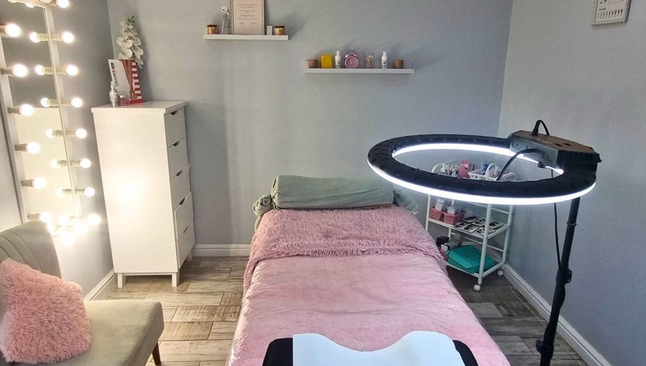 Cozy treatment room at Minutiae Beauty, Cape Town, Western Cape, ZA with plush bed and vibrant lighting.
