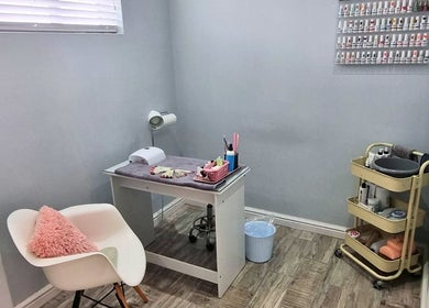 Minutiae Beauty nail care corner in Cape Town, Western Cape, ZA, featuring calm decor and organized polish display.