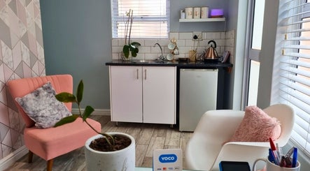 Inviting seating area and kitchenette at Minutiae Beauty, Cape Town, Western Cape, ZA.